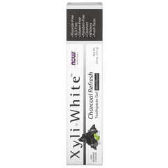 MKSTAVRINOS mouthwash bottle featuring NOW Foods XyliWhite Charcoal Refresh Mint toothpaste gel, 6.4 oz, with mint flavor and black packaging.