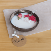 Small soy wax candle in a coconut bowl by Velarte, featuring a natural and cozy aesthetic with soft candlelight.