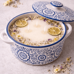 Velarte Mediterranean Bloom ceramic candle with floral design, featuring a white ceramic holder and a lit candle inside.