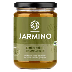 Jarmino organic vegetable broth in a 350ml glass jar, showcasing fresh vegetables and natural ingredients for vegan wellness.
