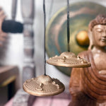 Tibetan Tingsha bell with Five Buddha design, approx 9.5cm, from AW Gifts, showing intricate metal craftsmanship and traditional symbols.
