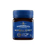 Jar of Herbalistas Haddrells Manuka Honey UMF10+ with MGO83+ in a 250g container, showing the honey's golden, smooth texture.