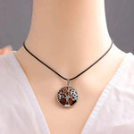 Tree of Life natural stone pendant on chakra necklace, energy stone crystal jewelry for women and men, with intricate design.