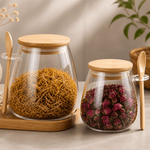 Two glass storage jars with bamboo lids and spoons, airtight kitchen organizers, from TEMU.