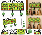 Hand-painted floral ceramic and metal wall hook rack with three hooks in green and red, ideal for home decor storage.