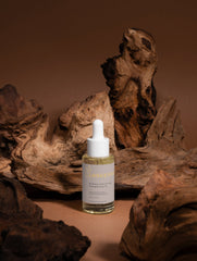 Selfnamed Rosemary Hair & Scalp Strengthening Oil bottle with dropper, highlighting natural herbal hair care product.