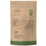 Kakau Worship Tropical Glacier Cardamom Chocolate Drink 150g package with vibrant tropical-themed design.