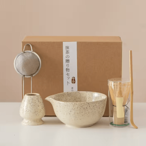 Set of five Japanese-style bamboo matcha accessories, including matcha scoops and whisks, in a traditional design.