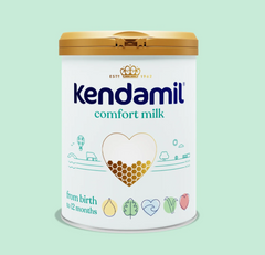 Kendamil Comfort Milk formula in a container with a scoop, designed for infants, by PETROUTSIOS.