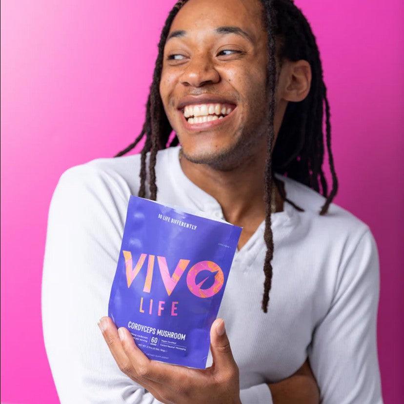 Vivo Life Cordyceps Mushroom Powder supplement jar with label, showing 60 servings of 10:1 extract in a natural setting.