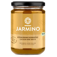 Jarmino organic chicken bone broth jar showing a clear, collagen-rich broth in a glass jar with a label, ready for cooking.
