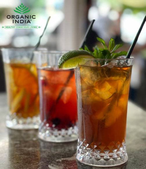 Organic India BIO Tulsi Green Tea Classic in infusion bags, featuring fresh green tea leaves and tulsi herbs.
