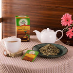 Organic India BIO Tulsi Turmeric Ginger herbal tea bags with fresh ginger and turmeric roots, caffeine-free for soothing infusions.