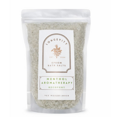 Green Epsom bath salt jar labeled Longevity Menthol Aromatherapy Recovery by AW GIFTS with a green and white design.