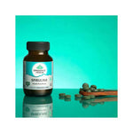 Organic India BIO Spirulina veggie tablets in a bottle, showing green tablets and label with product details.