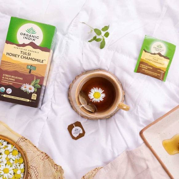 Organic India BIO Tulsi Honey Chamomile Tea in 25 infusion bags, caffeine-free herbal tea with honey and chamomile flowers.