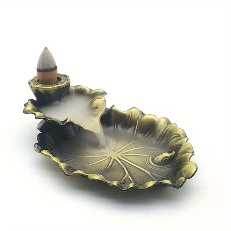 Lotus leaf-shaped metal backflow incense holder with intricate design for burning incense cones, ideal for creating calming ambiance.
