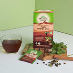 Organic India BIO Tulsi Masala Chai Tea infusion bags with aromatic spices and fresh tulsi leaves in a tea bag.