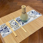 Set of four TEMU matcha accessories including bamboo whisk and tea spoon, ideal for preparing traditional matcha tea.