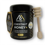 Spoonful of MountainDrop Shilajit and raw chestnut honey blend by Herbalistas in a glass jar with a wooden spoon.