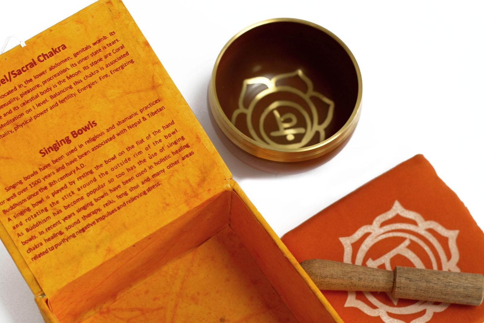 AW Gifts chakra singing bowl in navel size, a metal accessory with intricate design, used for meditation and sound healing.