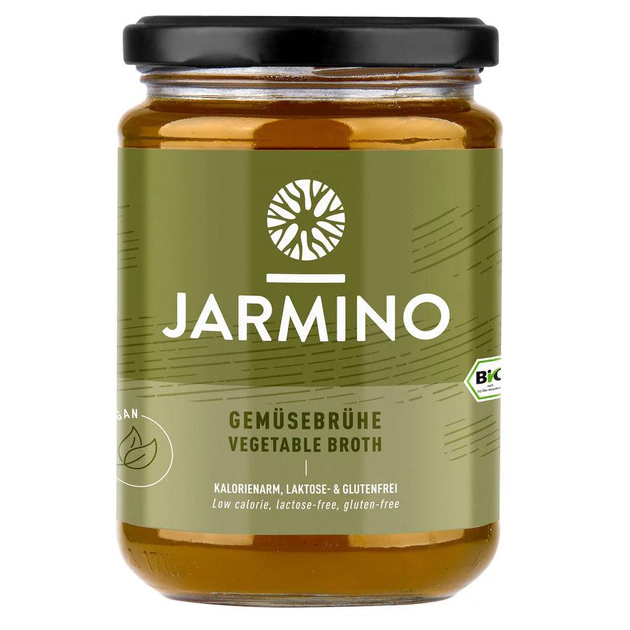 Jarmino organic vegetable broth in a 350ml glass jar, showcasing fresh vegetables and natural ingredients for vegan wellness.