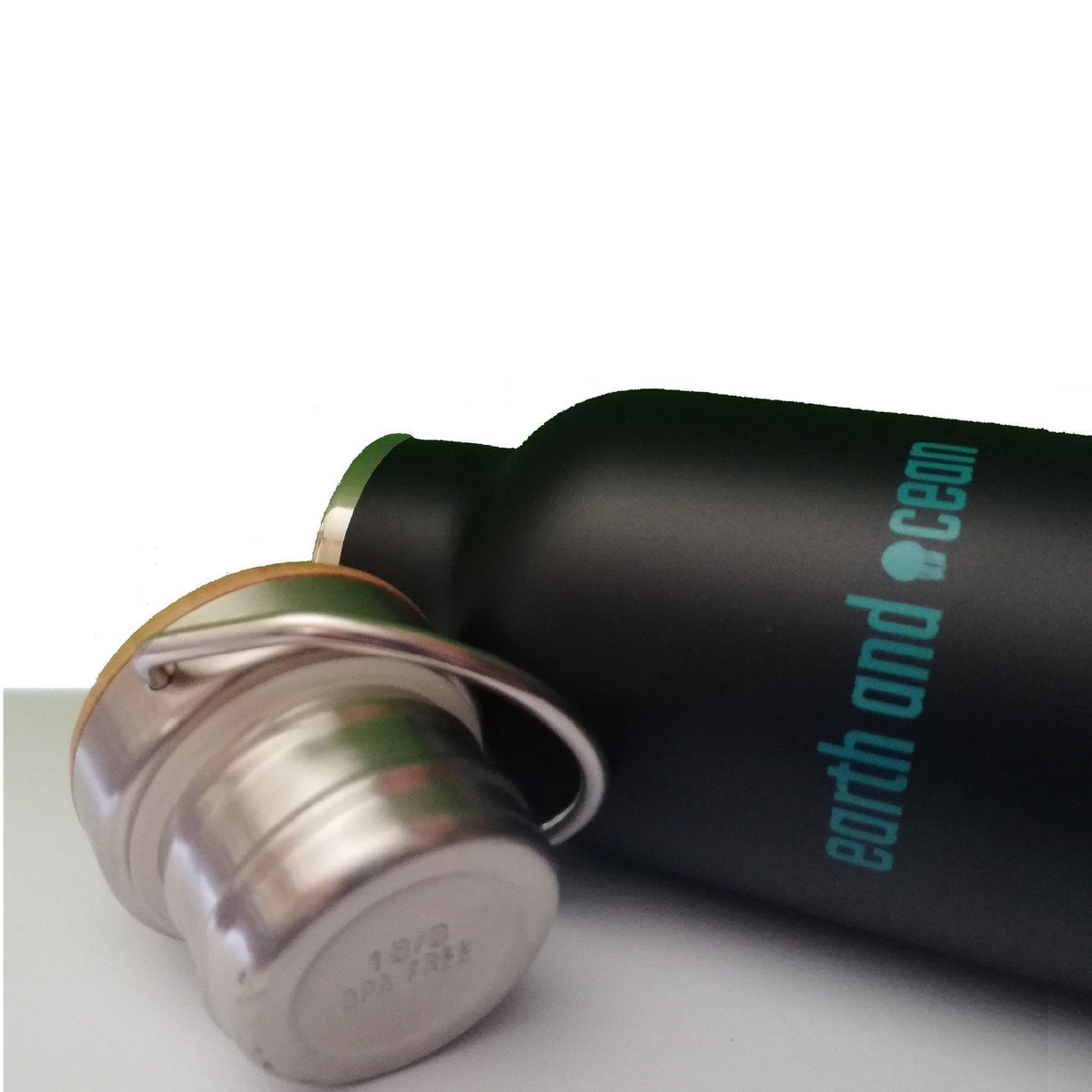 Stainless steel 600ml water bottle by OLD PRODUCTS featuring Earth and Ocean design, with a sleek, durable drink accessory.